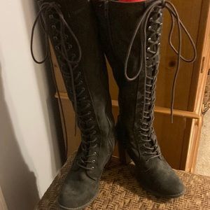 Tall, dark gray, lace up boots. Man made suede look.